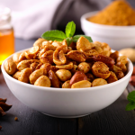 Bowl of festive roasted nuts seasoned with Paprika Lemon & Lime for a holiday appetizer